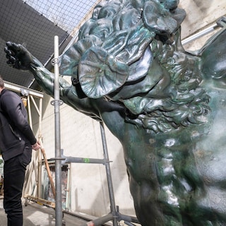 Atlas shines again on Royal Palace Amsterdam after renovation (with a 1916 time capsule in his globe)