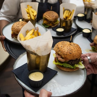 Four friends spent 12 years testing 100 burgers across Amsterdam’s five-star hotels, local pubs, and shady restaurants: ‘The fewer the frills, the better’