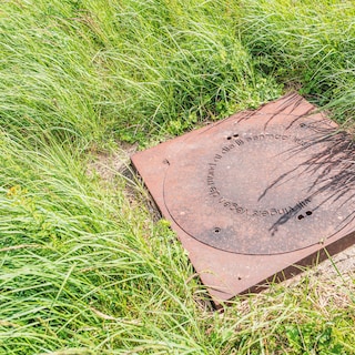 Imagine the imagery yourself with poet-artist Maria Barnas's texts on manhole covers in Diemerpark