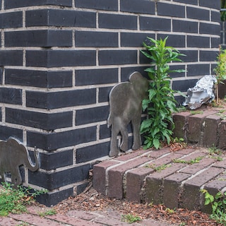 Anonymous steel elephants in staircase landing stir up stories about famous elephant Hansken