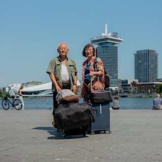 Chinese couple Ningsian (78) and Yang (75) arrive in Amsterdam on Interrail trip from Greece: I don't know much about this city, but it's a good transit point