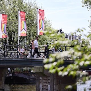 Amsterdam lights up dozens of buildings in rainbow colors during WorldPride