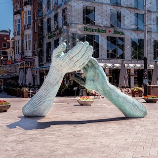 Two giant arms on Leidseplein commemorating Peter R. de Vries evoke strong reactions from passersby