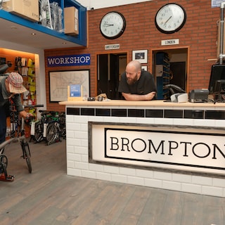 The Tromm family shop returns to the Overtoom as an official Brompton Junction: No one thinks, look at that show-off on a folding bike