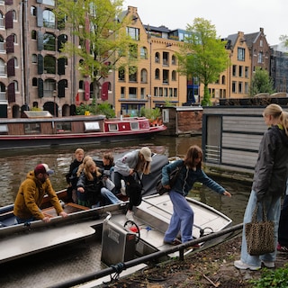 Ferry strike: Amsterdammers take boats, bikes, or Ubers across: 'A bit nerve-wracking because it's rocking and the weather is terrible'