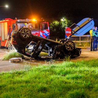 Car flips onto roof at A10-West exit, driver taken to hospital