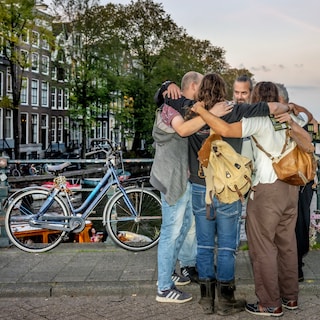 Men march through Amsterdam against violence against women, feminist groups critical of the term 'protect'